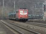 DB 140 024-1 mit einem Leeren Autozug in K�ln West am 12.2.2011